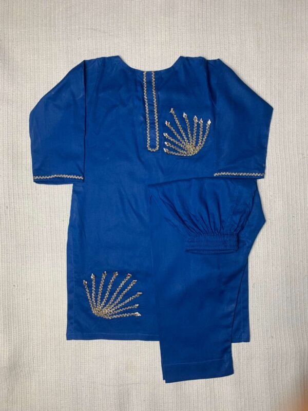 Blue traditional kids kurta and trouser set with golden gota work embroidery, laid flat on a white textured background for product display